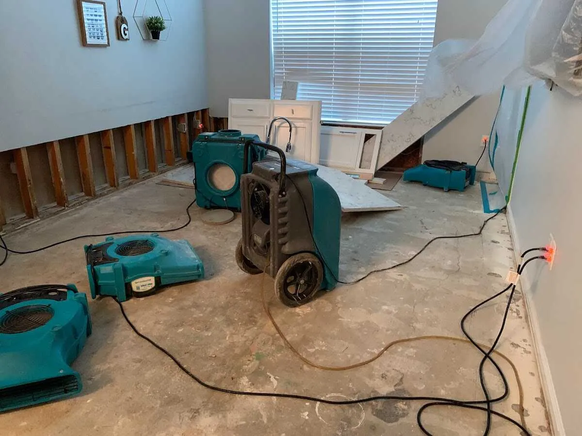 Dehumidifier in flood-cut room for Water Damage Restoration in Ludlow